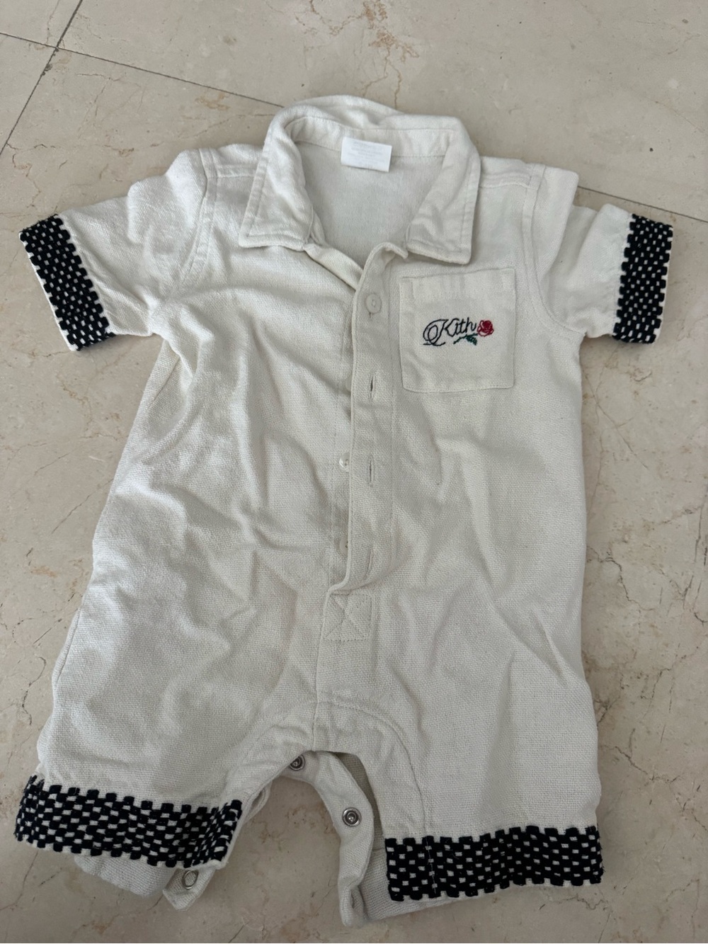 Kith Cream One-Piece Bodysuit with Black Trim